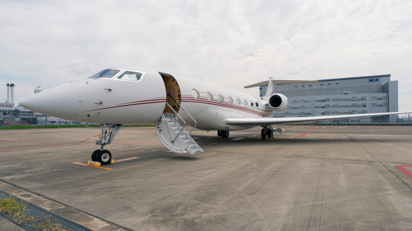 Exterior view of a 2014 Gulfstream G650ER showcasing its sleek, elegant design with a polished finish and streamlined silhouette.