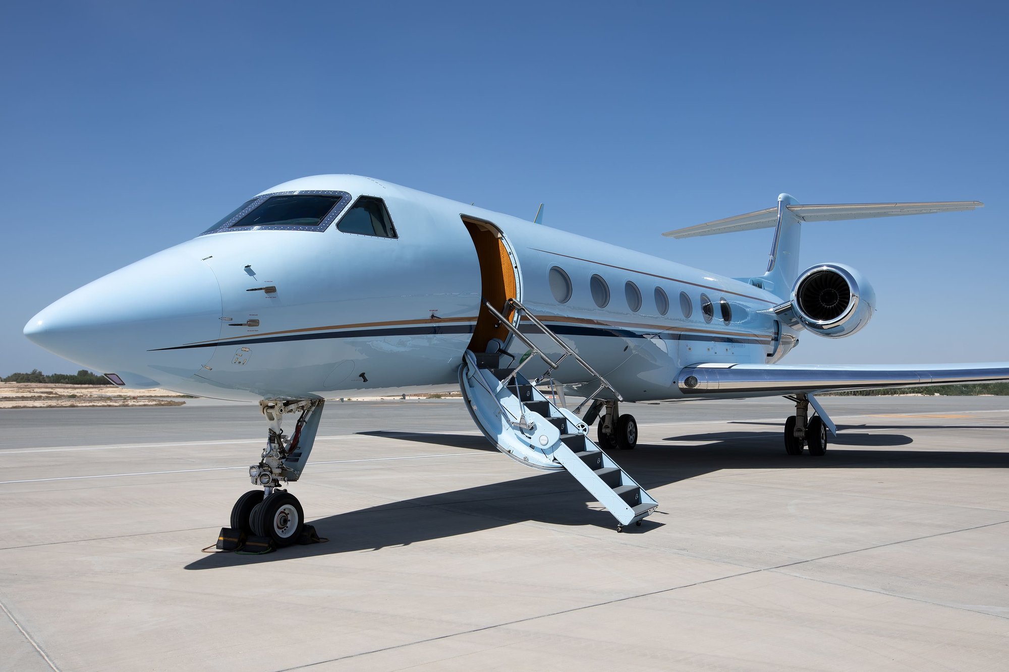 The 2010 Gulfstream G550 presents a striking profile in a sleek light blue finish, complemented by polished accents and a gracefully contoured nose. With its signature oval windows and powerful twin Rolls-Royce engines, this jet combines timeless aesthetics with intercontinental performance — designed for discerning owners who value both luxury and capability.