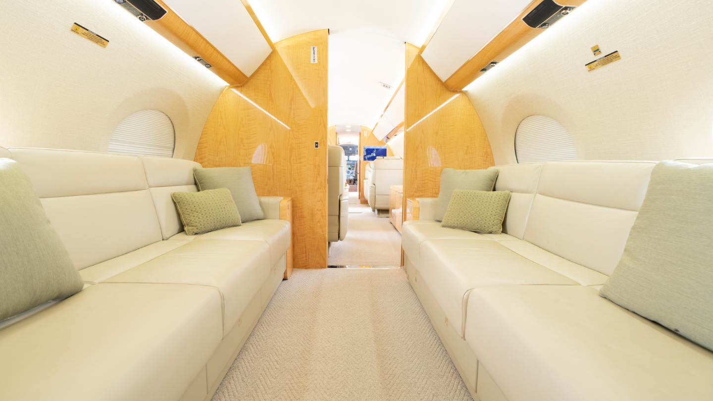 Luxurious aft cabin featuring two three-place berthing divans for comfort and relaxation during long flights.