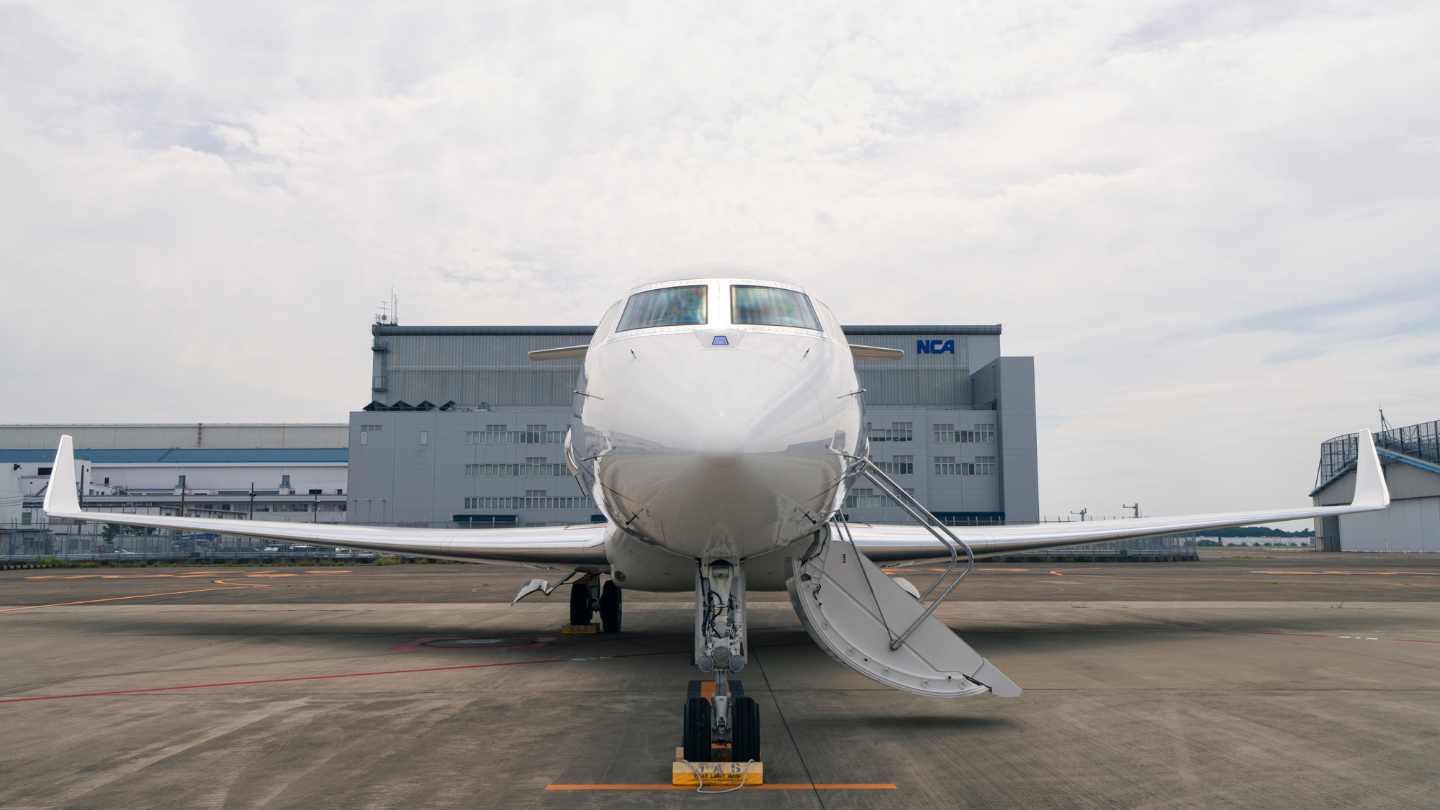  Exterior view of a 2014 Gulfstream G650ER showcasing its sleek, elegant design with a polished finish and streamlined silhouette.