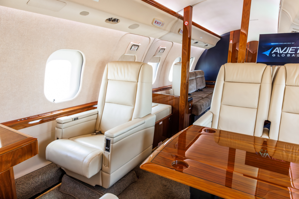 Side view of the mid cabin in a 2006 Bombardier Global XRS jet, showcasing a chair at a workstation.