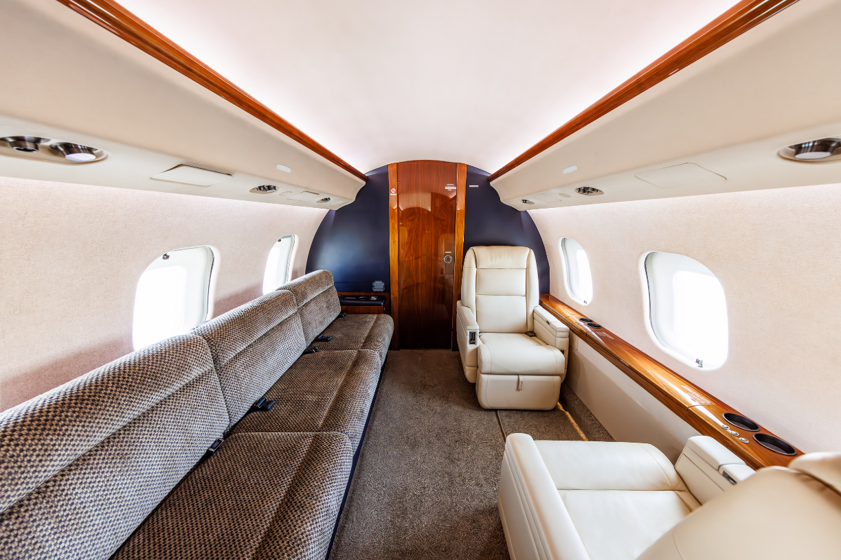 Aft cabin of the 2006 Bombardier Global XRS, showcasing left two-place club seating opposite a single berthing three-place divan.