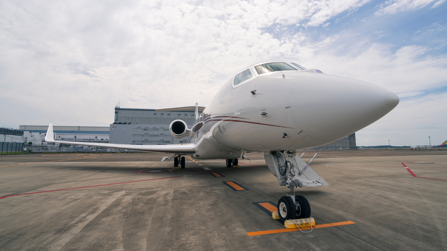  Exterior view of a 2014 Gulfstream G650ER showcasing its sleek, elegant design with a polished finish and streamlined silhouette.