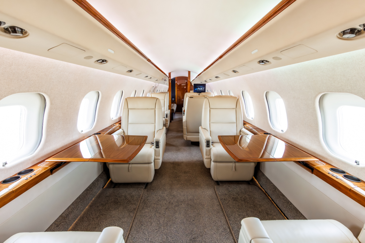 Forward cabin of the 2006 Bombardier Global XRS with four-place club seating and fold-out side ledge tables.