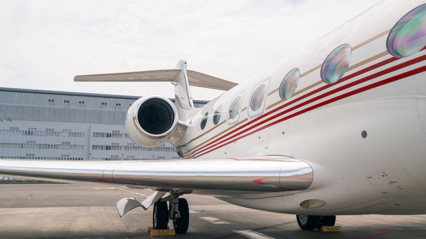  Exterior view of a 2014 Gulfstream G650ER showcasing its sleek, elegant design with a polished finish and streamlined silhouette.