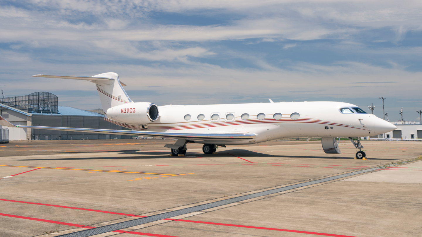  Exterior view of a 2014 Gulfstream G650ER showcasing its sleek, elegant design with a polished finish and streamlined silhouette.