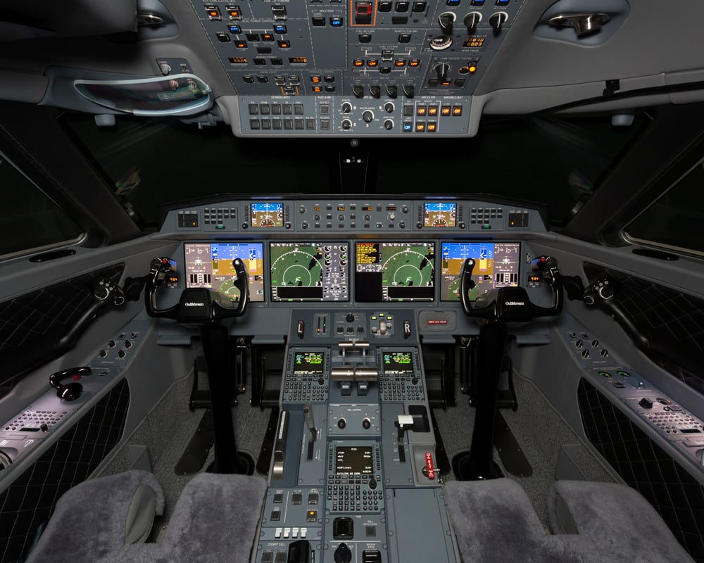 The 2016 Gulfstream G650ER Flight Deck features an advanced, modern cockpit with sophisticated avionics, ergonomic pilot seating, and a highly functional layout designed for efficient long-range flight operations.
