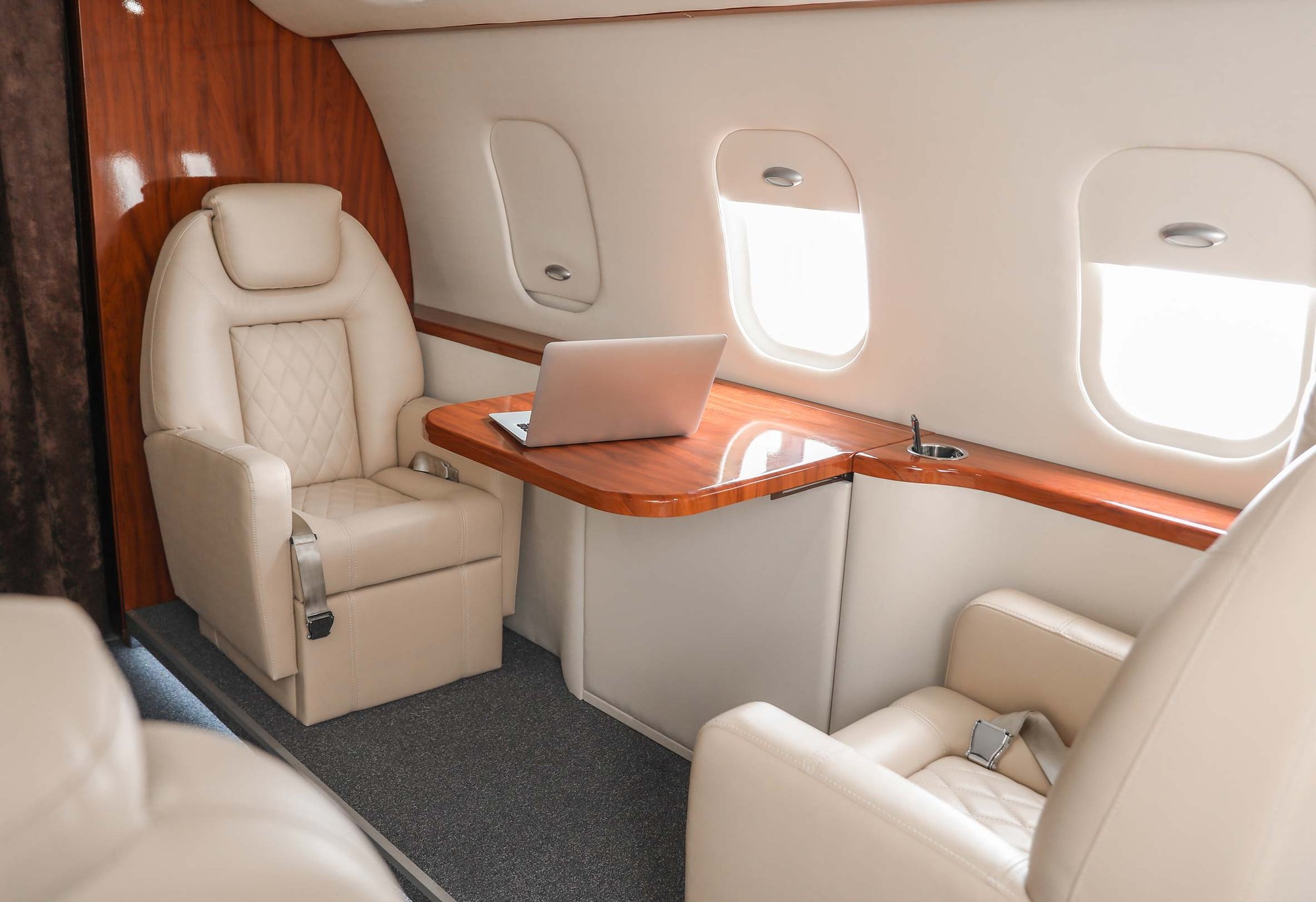 Empty seat at a desk on a private jet