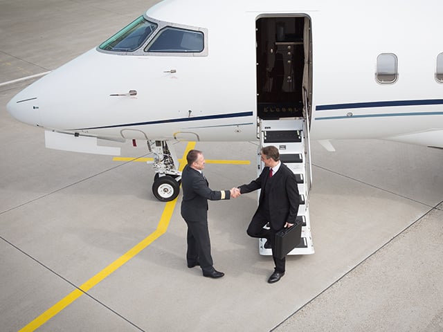 Businessman Exiting Plane