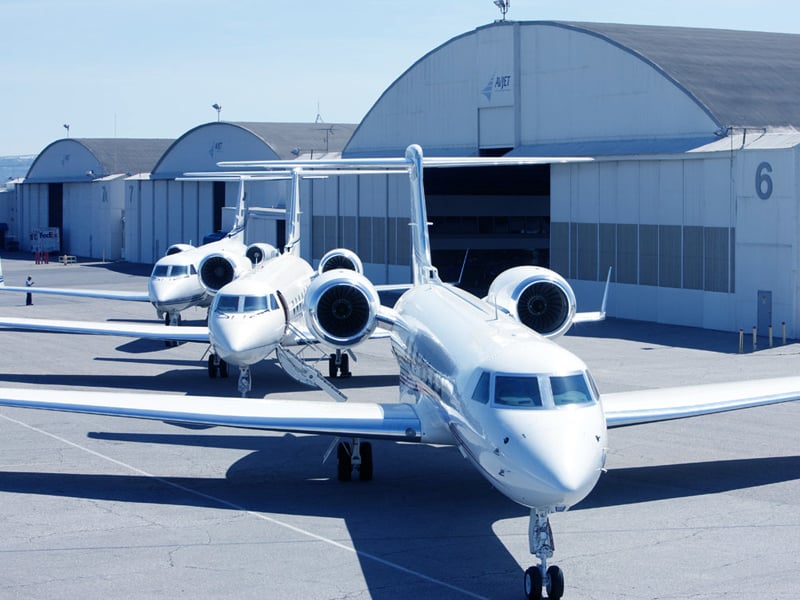 Avjet Fleet arrayed in front of a hangar