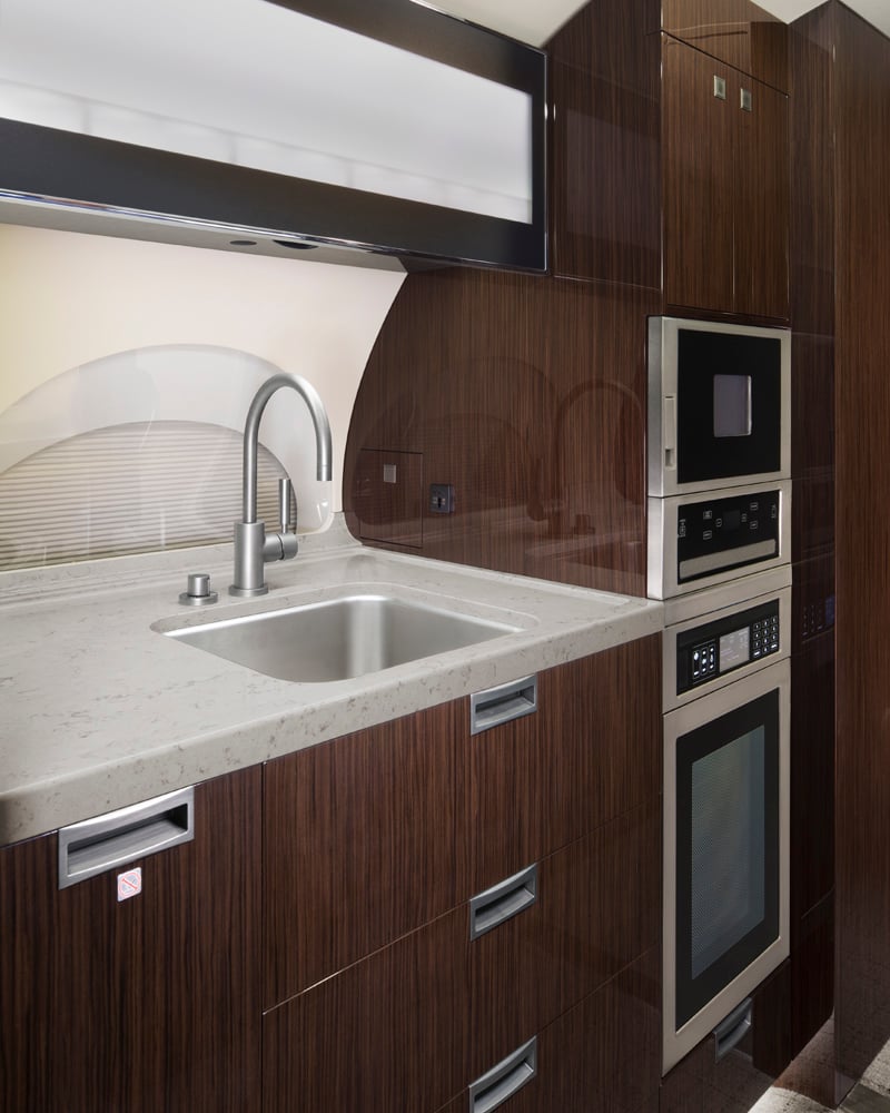 Forward Galley offers a refined and functional space designed for efficient in-flight service, featuring premium finishes and convenient amenities for an elevated travel experience.
