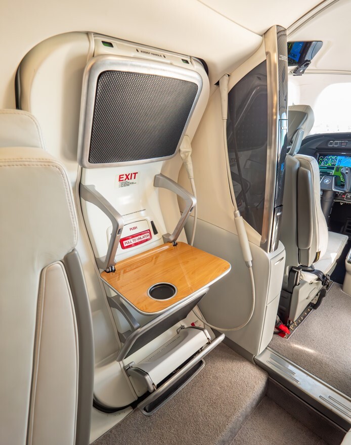 2022 HondaJet Elite S cabin jump seat with fold-out table, integrated storage, and compact forward cabin design adjacent to the cockpit area.