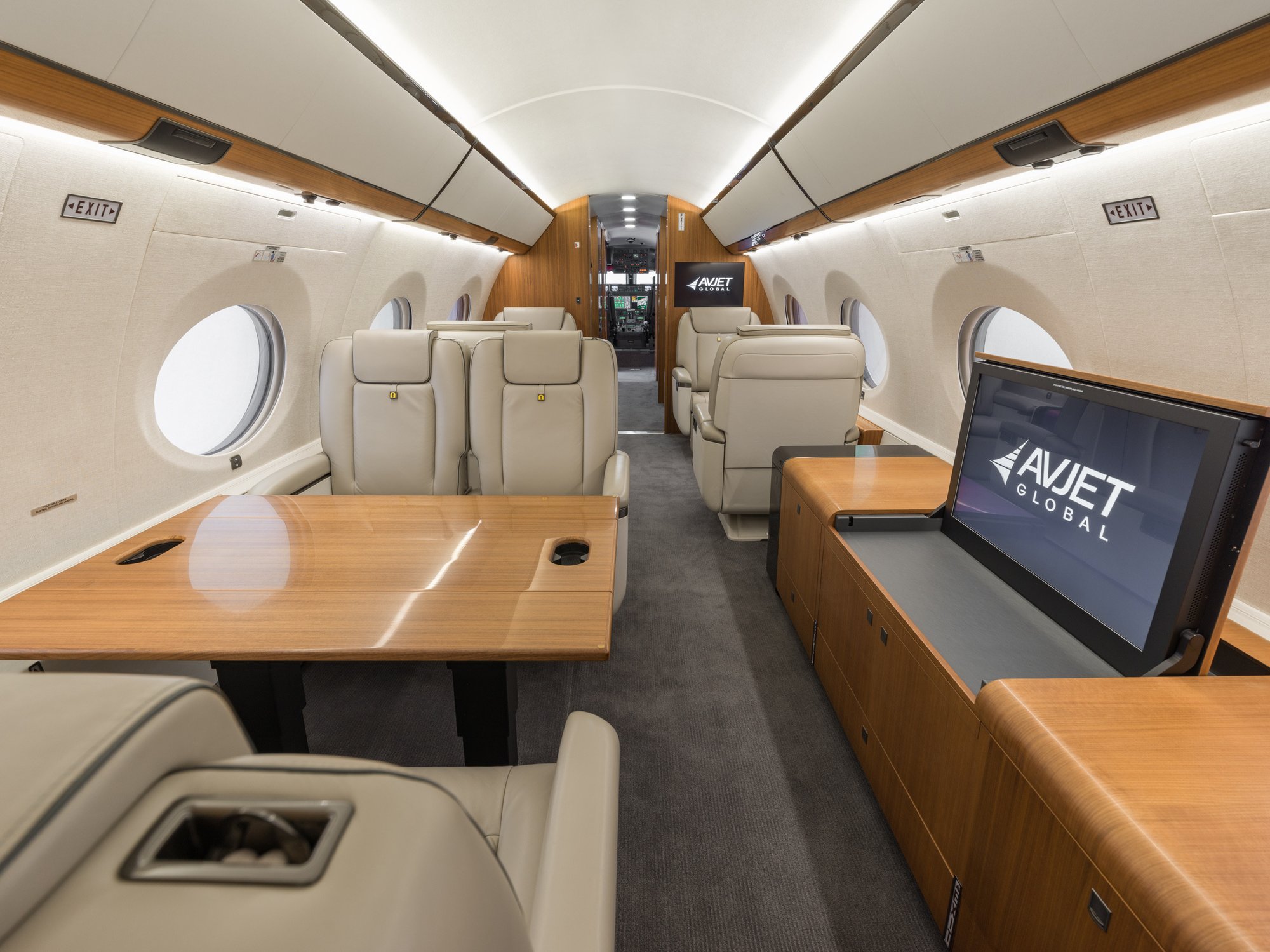 Mid-cabin view of the Gulfstream 650ER looking forward, revealing the elegant transition to the forward cabin with premium seating and state-of-the-art amenities