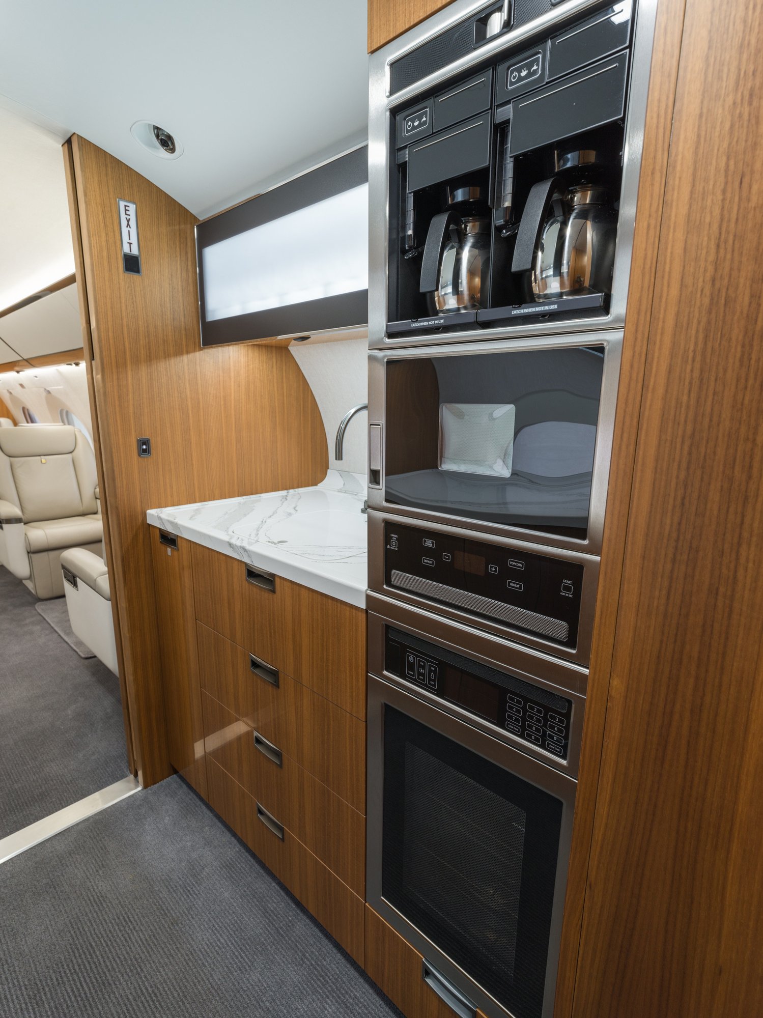 State-of-the-art galley of the Gulfstream 650ER, equipped with premium appliances and ample storage, designed for gourmet in-flight dining