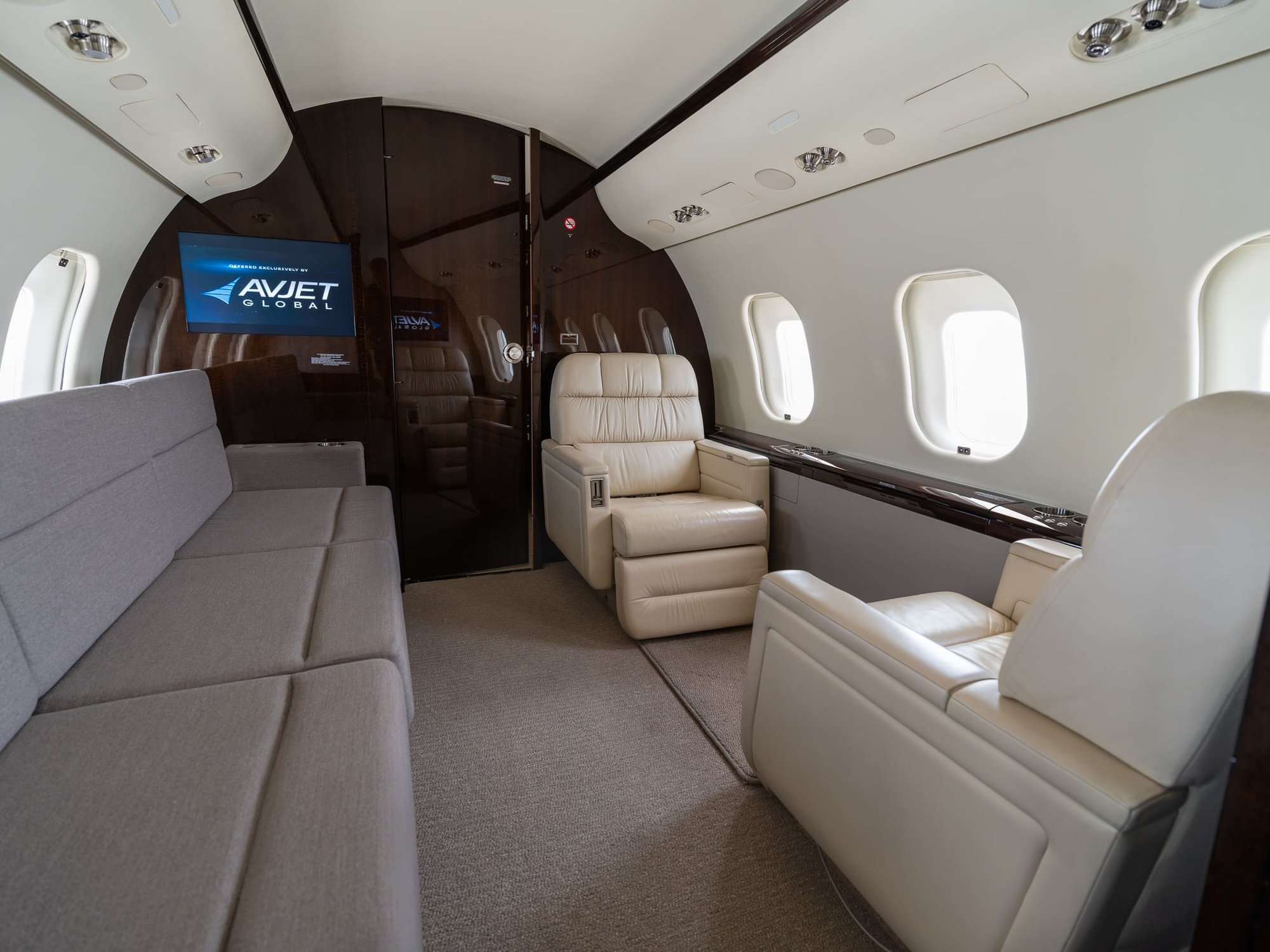 The Cabin Lounge of the 2007 Bombardier Global XRS offers a refined and comfortable space featuring plush seating, premium wood finishes, and an integrated entertainment system. Designed for relaxation and privacy, this elegant cabin combines luxury, comfort, and functionality for long-range travel.