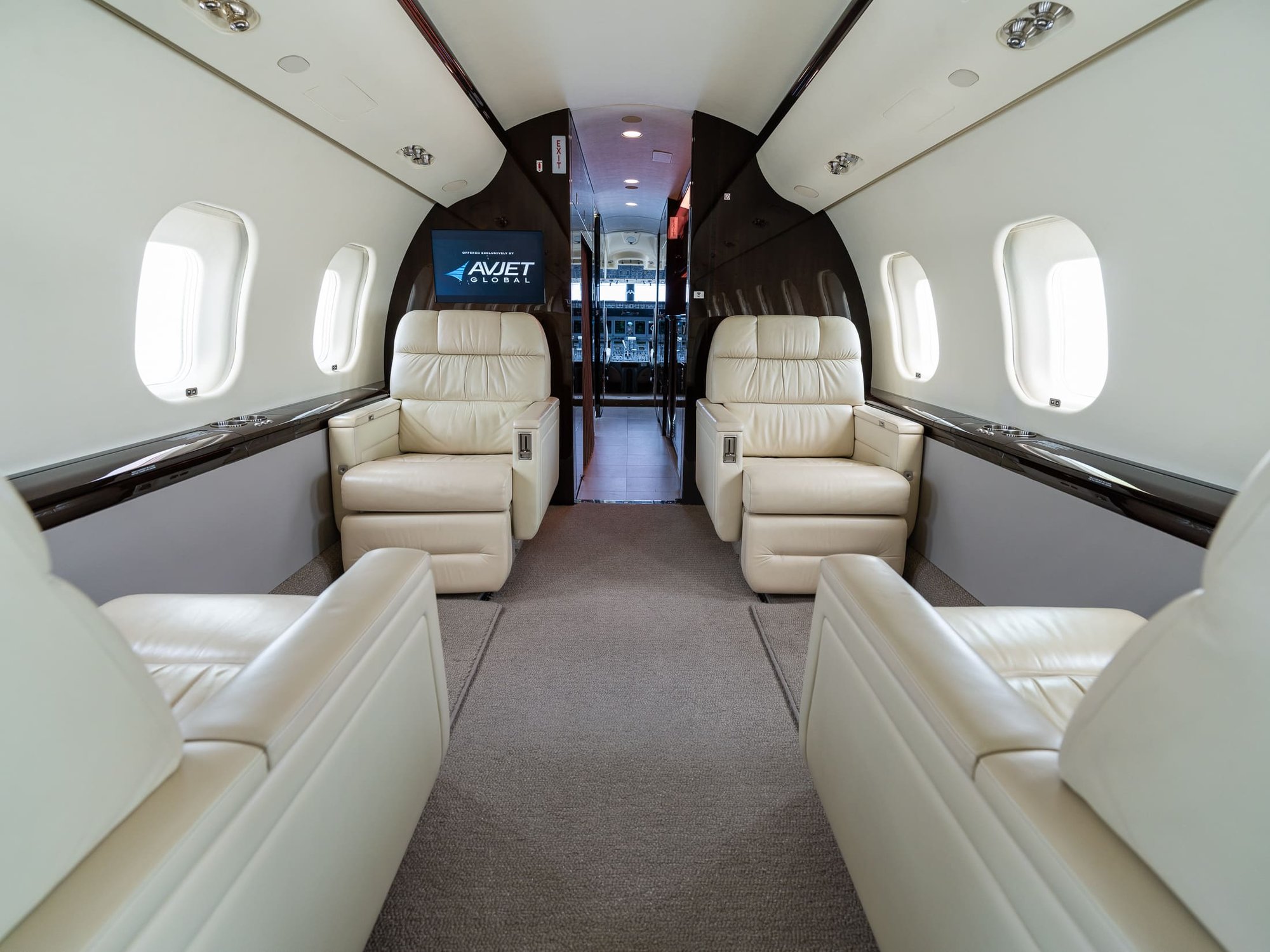 The Forward Cabin – Looking Forward of the 2007 Bombardier Global XRS features spacious executive seating, premium leather upholstery, rich wood accents, and integrated entertainment. With generous natural light and a refined cabin layout, it offers exceptional comfort for long-range private travel.