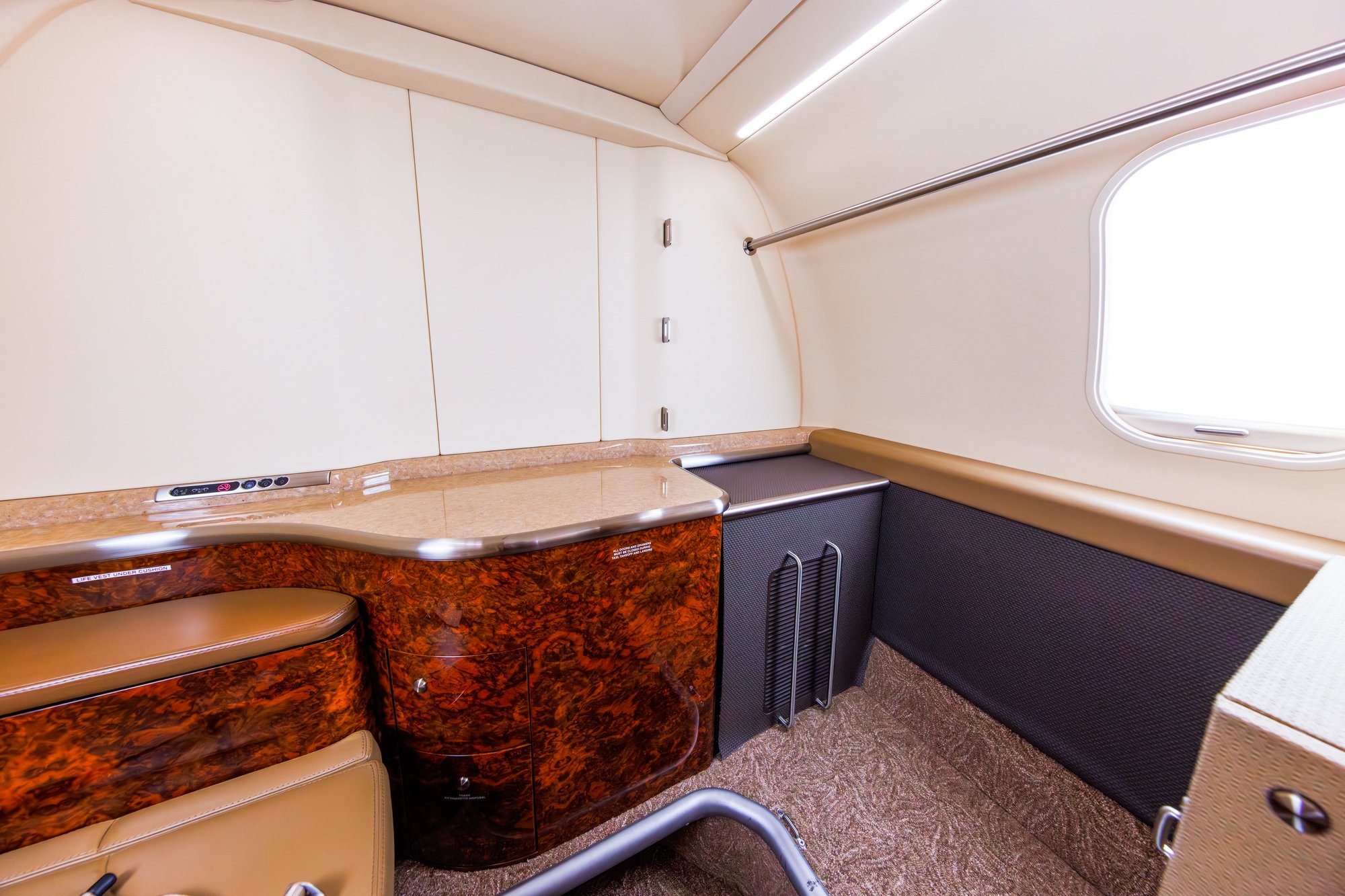 Aft lavatory of the 2006 Learjet 45 XR, showcasing sleek design and high-end fixtures for a luxurious and comfortable in-flight experience.