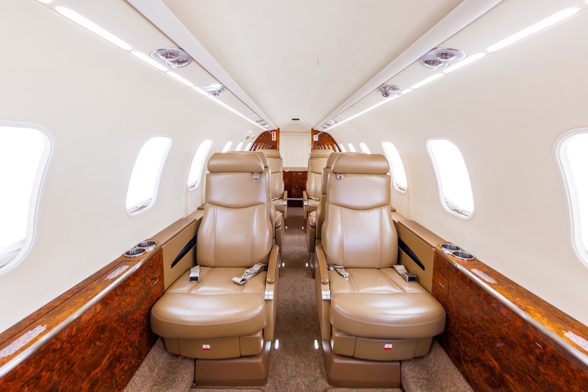 Forward view from the aft cabin of the 2006 Learjet 45 XR, showcasing luxurious leather seating and refined interior design for an exceptional private jet experience.