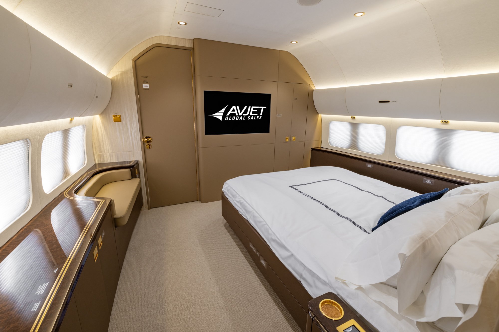 The VIP Stateroom of the 2018 Boeing Business Jet 2 (BBJ2) offers a private sanctuary designed for ultimate comfort and relaxation. Featuring a spacious full-size bed, elegant wood finishes, integrated entertainment system, and refined ambient lighting, this luxurious suite provides a quiet and sophisticated space for restful long-haul travel.