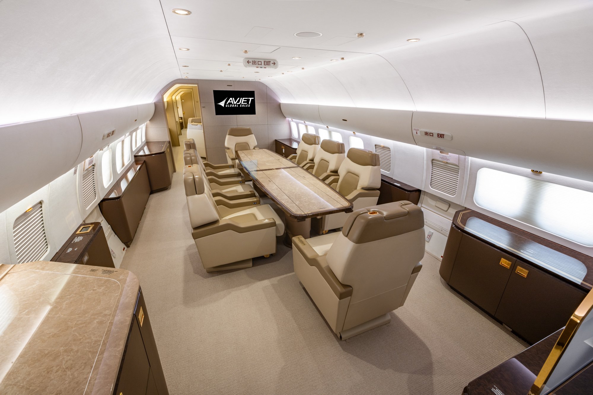 The VIP Dining Area of the 2018 Boeing Business Jet 2 (BBJ2) offers a luxurious and versatile space designed for private dining, executive meetings, and in-flight collaboration. Featuring premium leather seating, a large conference table, elegant wood finishes, and refined ambient lighting, this exclusive cabin combines comfort, sophistication, and functionality for an exceptional private jet experience.