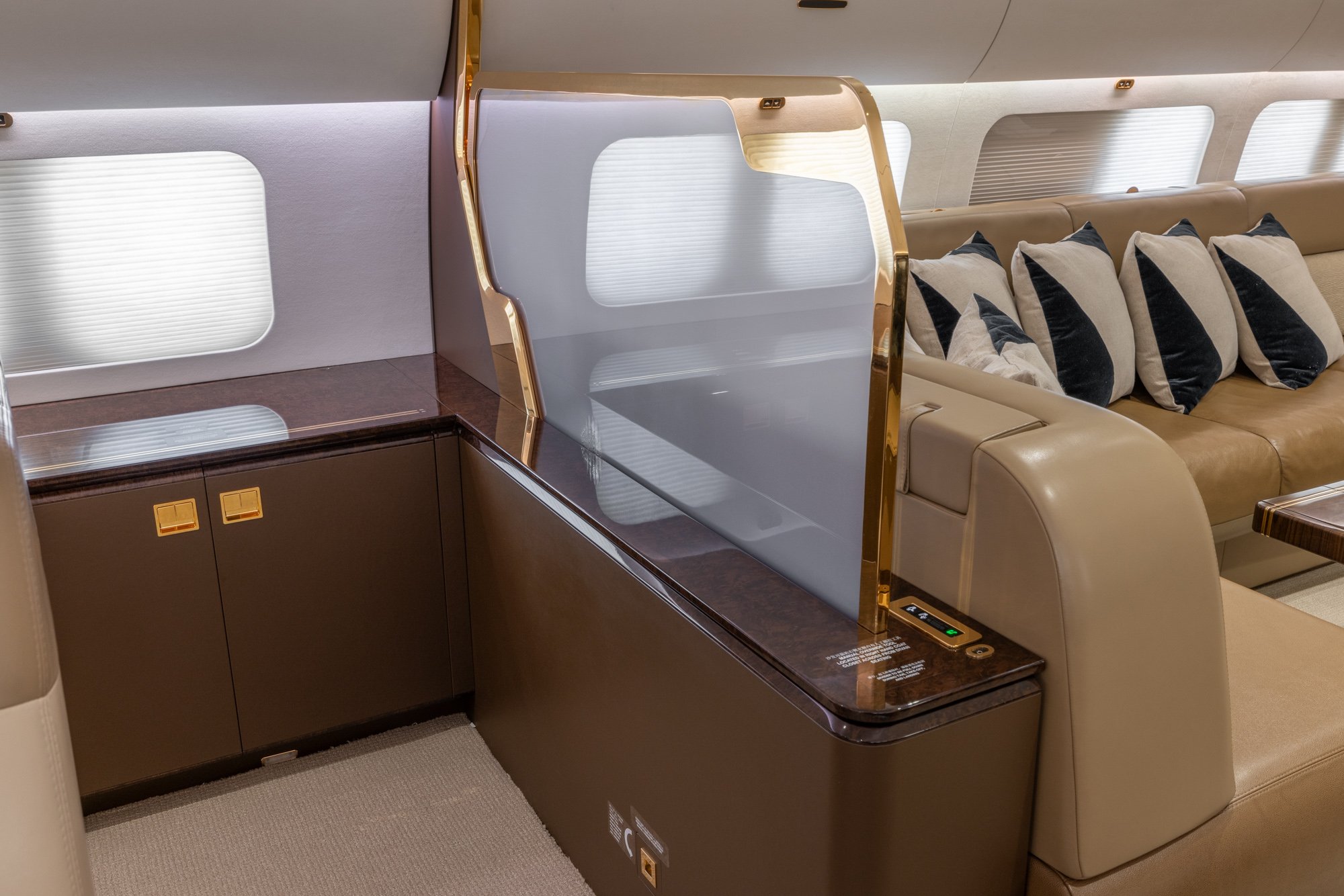 Private storage area adjacent to custom cabinetry, providing discreet organization space and enhanced privacy within the VIP cabin of the Boeing Business Jet 2 (BBJ2).