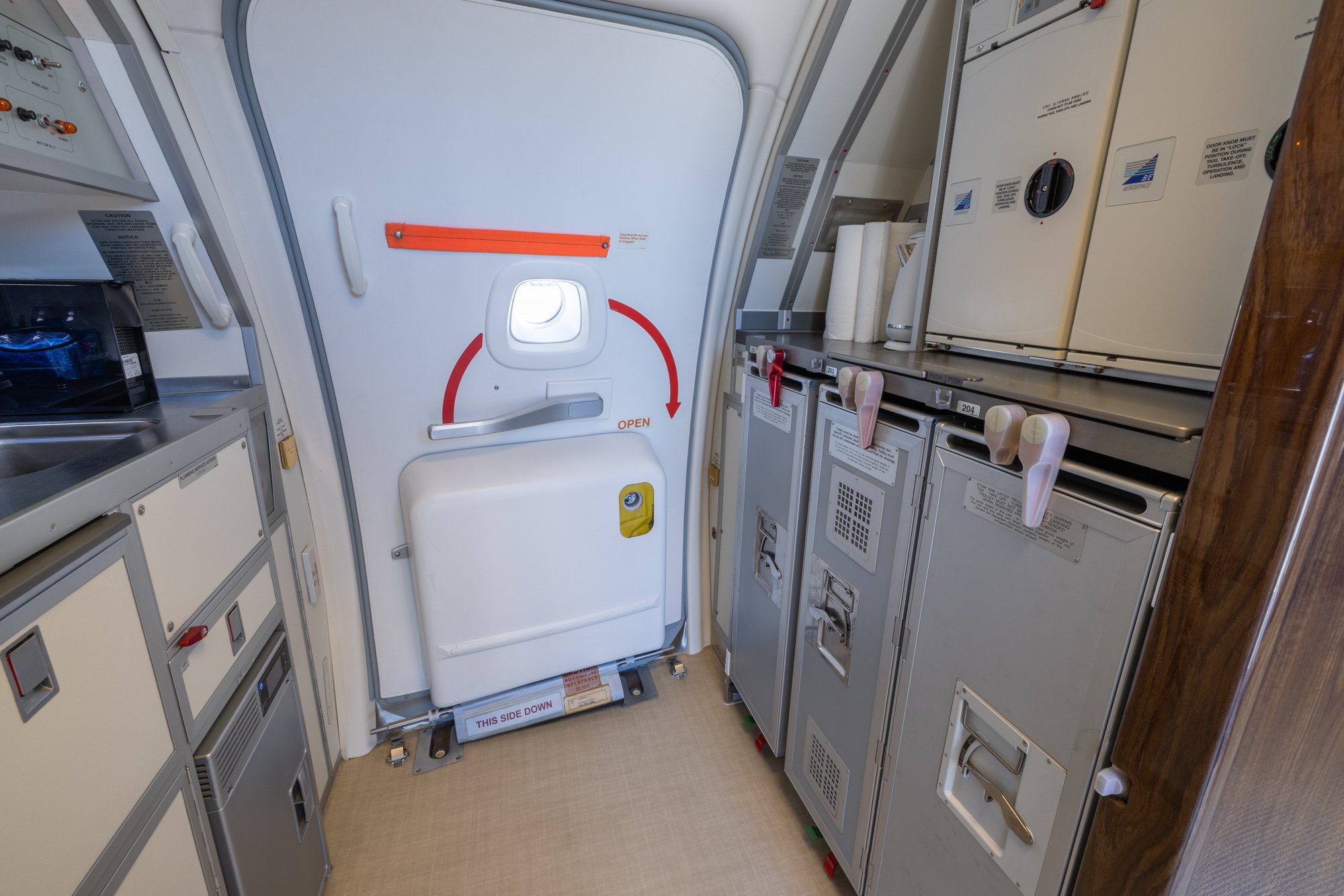 Forward Galley featuring custom cabinetry, integrated storage, and premium service amenities designed to support luxury in-flight dining aboard the Boeing Business Jet 2 (BBJ2).