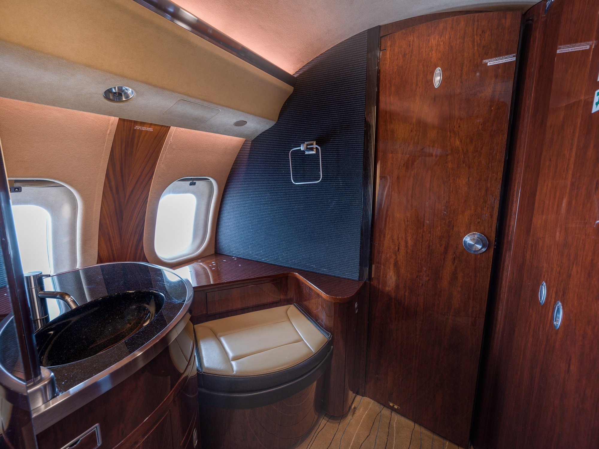  Aft lavatory of the 2007 Bombardier Global XRS, featuring premium fixtures and sophisticated design, ensuring comfort and luxury for private jet passengers