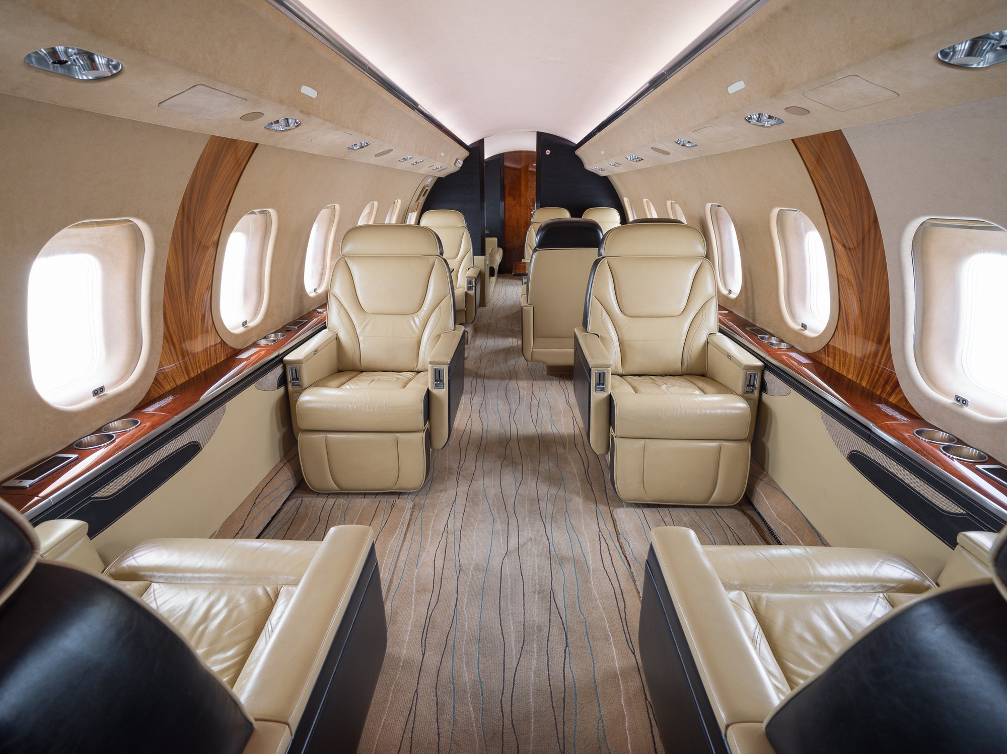 Forward cabin of the 2007 Bombardier Global XRS with four luxurious leather seats, designed for ultimate comfort and sophistication in private air travel.