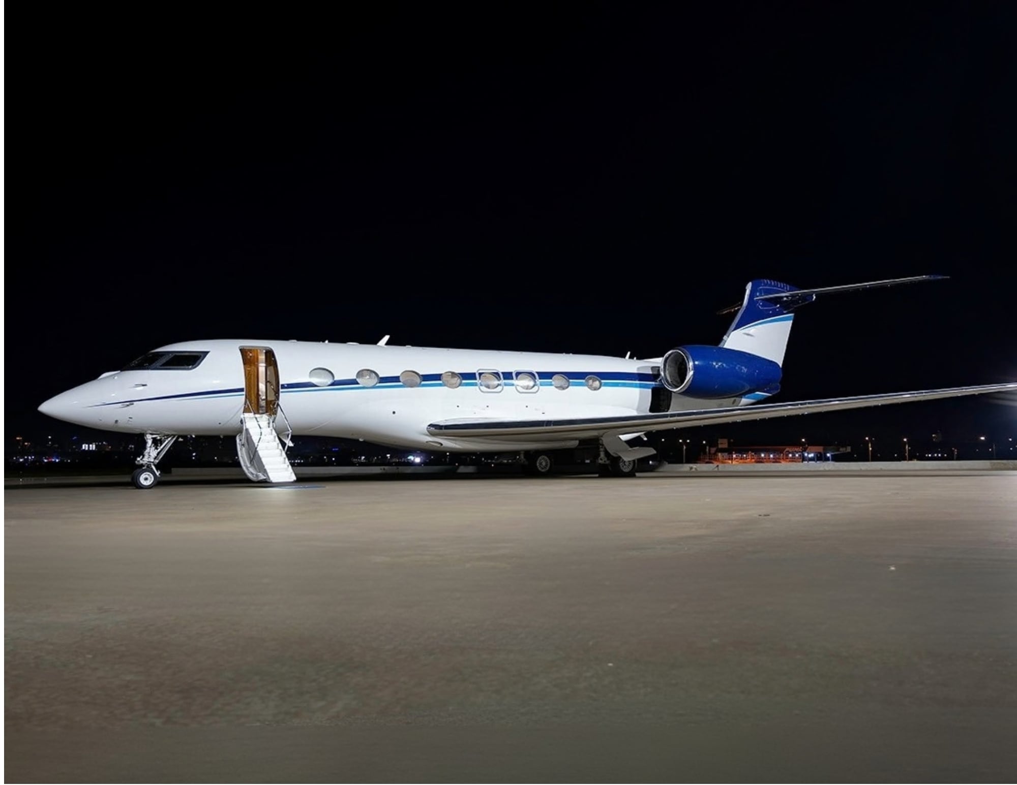 Exterior of a 2015 Gulfstream G650ER on the ramp at night