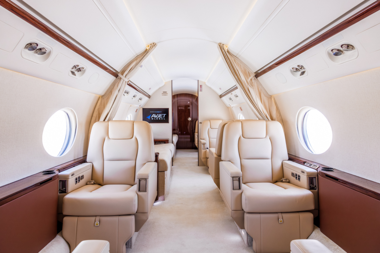 9Interior view of the first four seats in the 2016 Gulfstream G550, featuring luxurious leather seating, spacious cabin, and modern amenities.