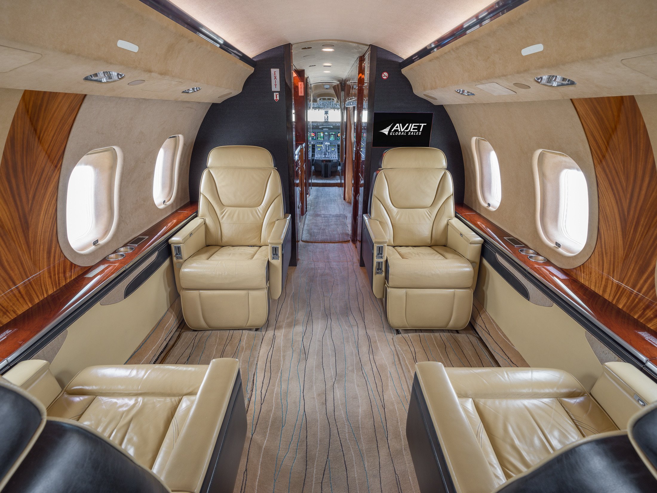 Forward cabin of the 2007 Bombardier Global XRS with four luxurious leather seats, designed for ultimate comfort and sophistication in private air travel.