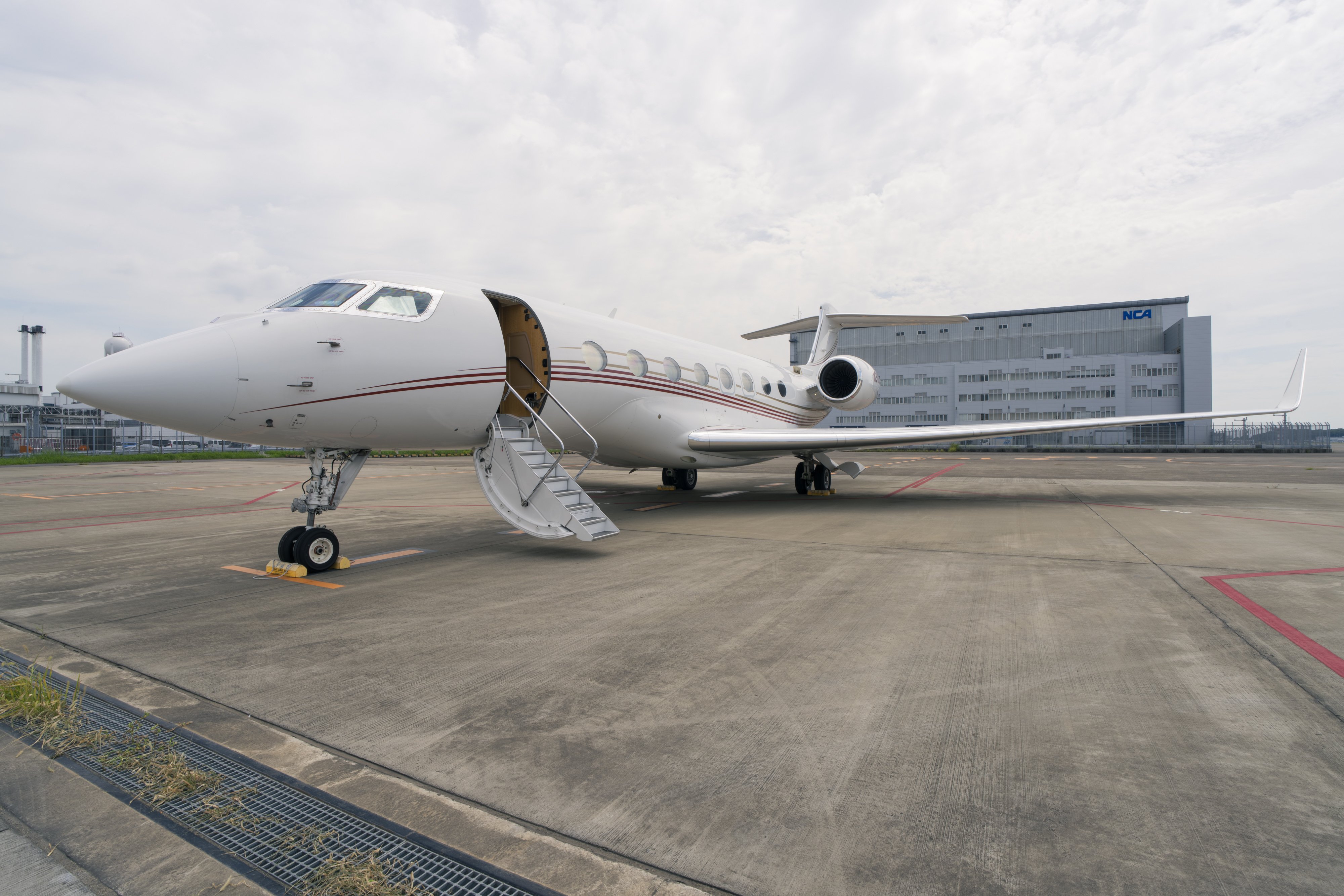 Exterior view of a 2014 Gulfstream G650ER showcasing its sleek, elegant design with a polished finish and streamlined silhouette.